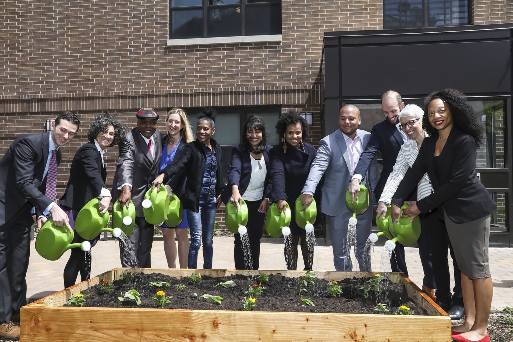 Partners commemorate the opening of the Henry Apartments in Brooklyn